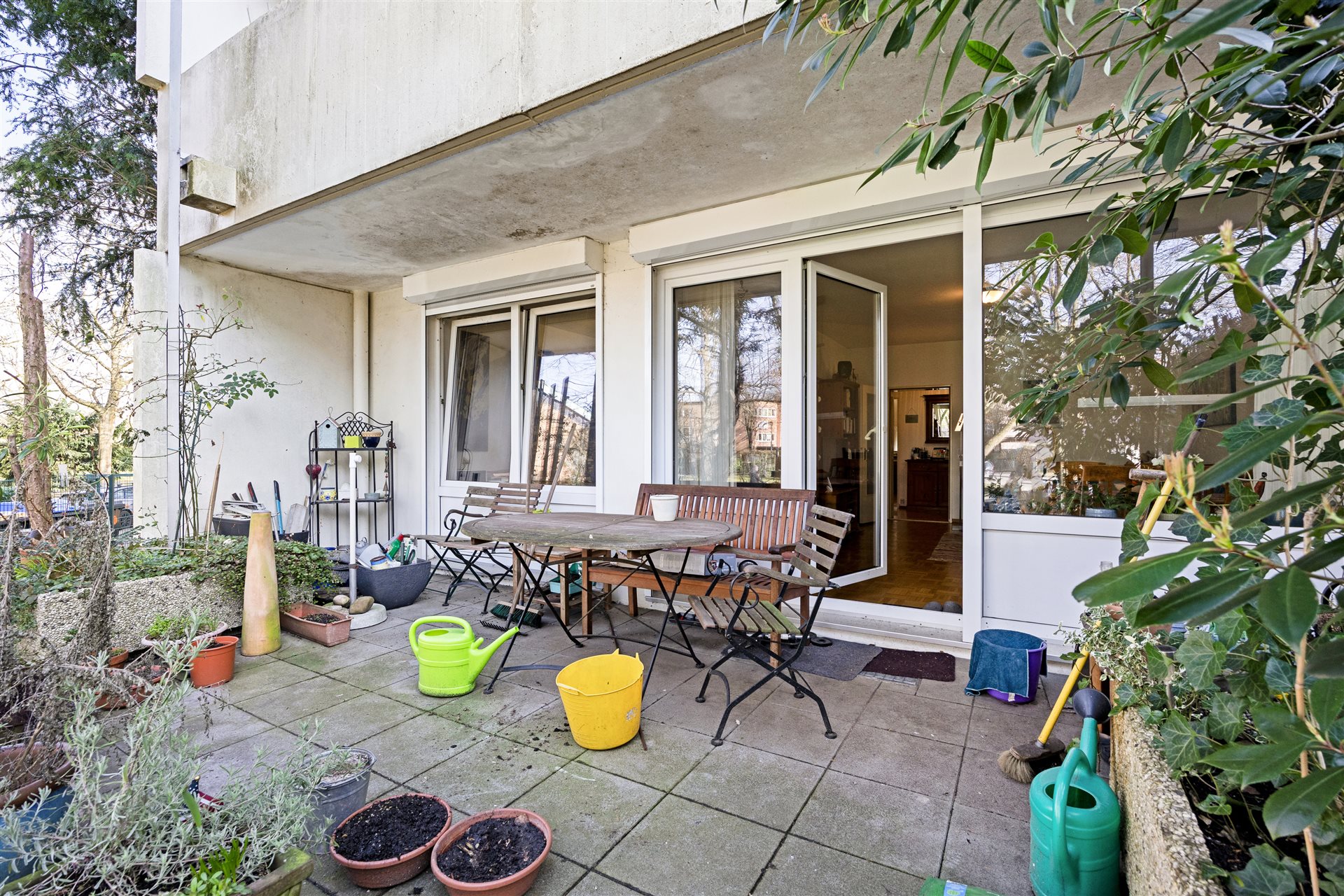 Eigentumswohnung Münster-Aaseestadt – Terrasse mit Sitzbereich und Gartenblick