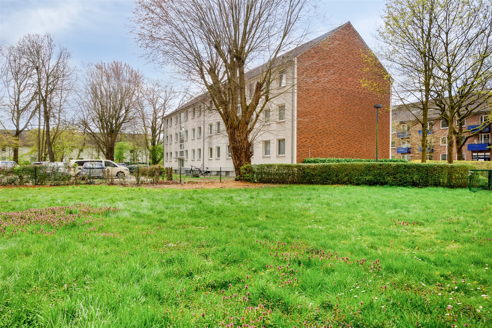 Eigentumswohnung Münster-Coerde – Außenansicht mit Grünfläche