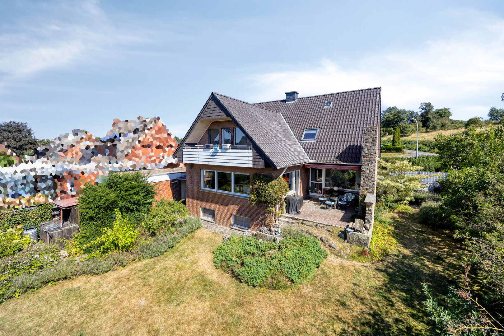 Zweifamilienhaus in Billerbeck – Außenansicht mit Garten und Garage