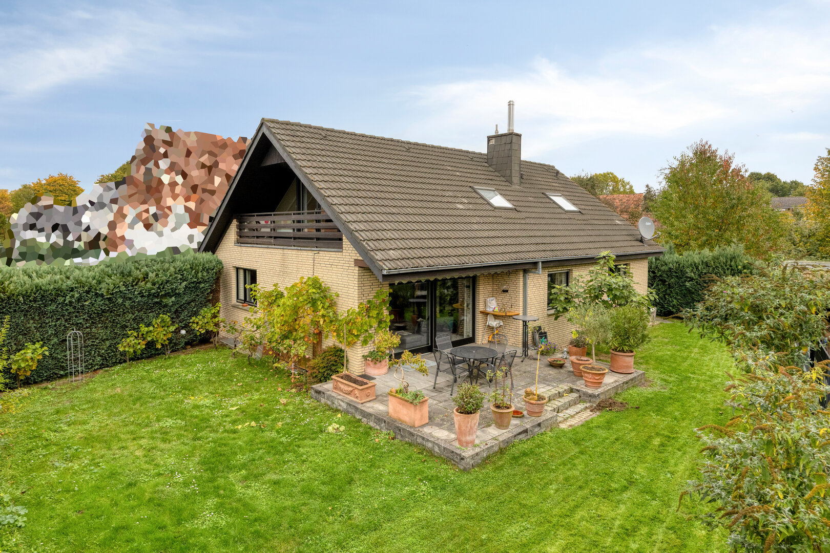 Einfamilienhaus Münster-Gelmer – Außenansicht mit Garten und Terrasse